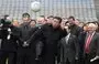 
Chinese President Xi Jinping kicks a Gaelic football as he visits Croke Park in Dublin, Ireland, on February 19, 2012, when he was vice president of China. [Peter Muhly/AFP]        