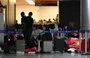 
Pasajeros de India y Vietnam permanecen varados en el Aeropuerto Internacional de Guarulhos en São Paulo, Brasil. [Juan Pablo Flores/AFP]        