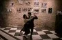 
Los taxi dancers profesionales de tango David Tolosa y Laura Florencia Guardia posan para una fotografía durante una milonga en el icónico salón de tango Marabú en Buenos Aires. [Juan Mabromata/AFP]        