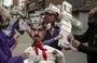 
Opponents of Venezuelan dictator Nicolás Maduro prepare to burn a dummy featuring the images of Maduro (C-Bottom), Russian President Vladimir Putin (C-Top), Caracas Mayor Carmen Melendez (L) and former Minister of the People's Power for Interior Relations and Justice Néstor Reverol (R) during the traditional 'Burning of Judas' event as part of Holy Week celebrations in Caracas in April 2022. [Yuri Cortez/AFP]        