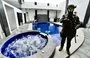 
An Ecuadorian soldier stands guard inside a luxury house during a joint military–national police operation in Duran, Guayaquil, Ecuador. [Marcos Pin/AFP]        