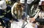 
Bolivian President Luis Arce inspects the inaugural sample of lithium carbonate at the opening ceremony of Bolivia's first state-owned lithium carbonate industrial plant in Colcha "K", south of the Salar de Uyuni, Potosí Department, in December 2023. [Jorge Bernal/AFP]        