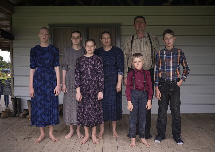 Mennonite David Klassen (2nd R), 45, poses for a picture with his family at their home in the community of Masisea, Ucayali department, Peru. [Ernesto Benavides/AFP]