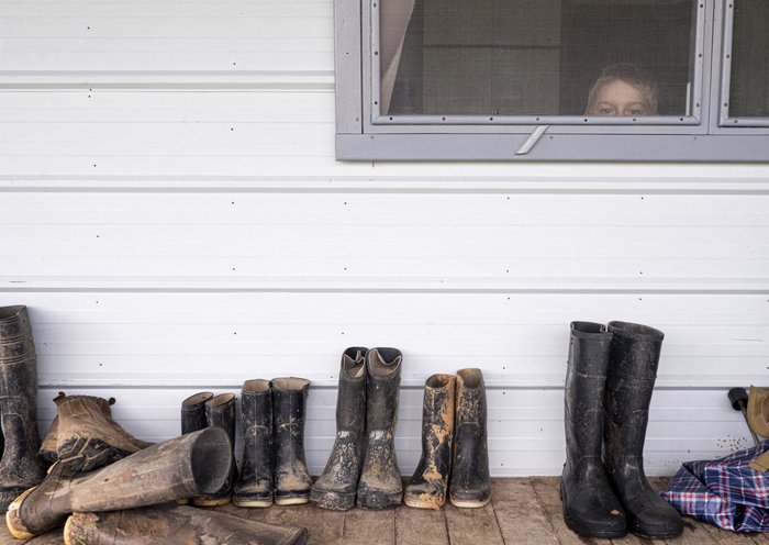 A Mennonite boy looks out the window in the community of Masisea, Ucayali department, Peru [Ernesto Benavides/AFP]